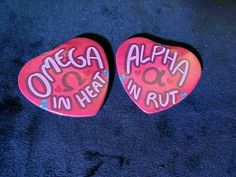 two pink guitar picks with the words'oheaa aloha in her rut'written on them