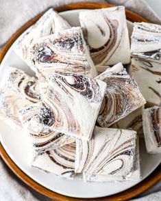 white and brown swirled desserts on a plate