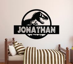 a wall decal with the name and image of a dinosaur