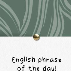 an english phrase is displayed on a white paper with a gold button in the middle