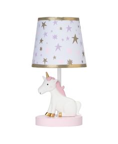 a pink and gold lamp with a white unicorn on it's side next to a star patterned shade