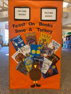 an orange sign with books on it that says feast on books, save a turkey