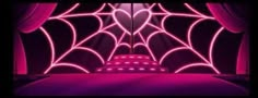 a room with pink lights and a spider web on the wall in front of it