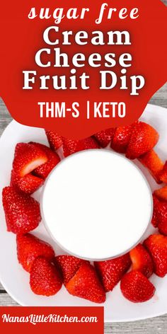 a white plate topped with strawberries next to a red heart shaped sign that says, sugar free cream cheese fruit dip