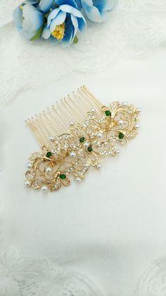 Introducing Edith, a breathtaking hair comb meticulously crafted in the style of an old Edwardian headpiece. This exquisite accessory is designed to transport you to the elegance and charm of a bygone era. The Edith hair comb features a stunning combination of paste rhinestones and ivory pearls, carefully arranged to evoke a sense of vintage allure. The intricate flower design adds a touch of delicacy and refinement, making it a truly remarkable piece that is sure to turn heads. Crafted in a regal gold tone, this Edwardian-inspired hair comb exudes a timeless beauty that effortlessly complements any hairstyle. It will look whimsical with a veil adding a touch of enchantment and allure, enhancing your overall look with a touch of mystique. Indulge in the elegance and sophistication of the E Veil Hair Piece, Edwardian Hair, Prom Gold, Veil Hair, Edwardian Hairstyles, Comb Veil, Vintage Headpiece, Green Themed Wedding, Gold Hair Comb