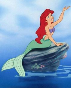 ariel from the little mermaid sitting on top of a rock in the ocean with her arms outstretched