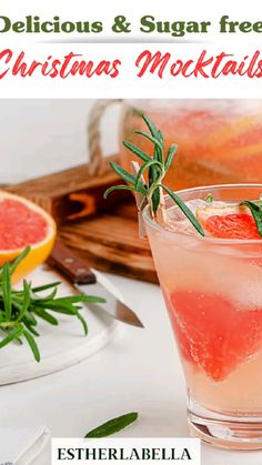 a christmas mocko cocktail with rosemary garnish and grapefruit on the side