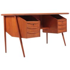 a wooden desk with two drawers on each side and one drawer at the top that is open