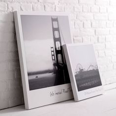 an old photo frame with the golden gate bridge in black and white is sitting on a shelf