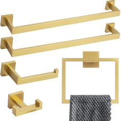 gold bathroom accessories including towel bars and towels