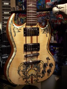 an electric guitar sitting on top of a table