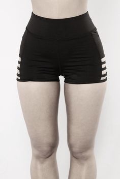 a woman in black shorts with white stripes on her butts and the bottom part of her pants