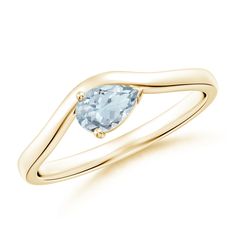 a yellow gold ring with an aqua blue topazte in the center and a curved band