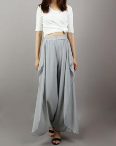 * Beautiful pearl chiffon pants, very comfortable to wear, not easy to get wrinkled, very easy to take care of.* Add an asymmetric layer on the front, very unique and beautiful.* Material: outer-pearl chiffon, lining-100% polyesterCustom made to fit, lead time is 6-8 days;Let us know your usual size in your country and your overall height.If you have some specific request or special characters such as broad shoulder, long arms, long waist, etc you think we need pay attention to when making, do l Versatile Flowy Long Skirt, Versatile Baggy Harem Pants For Summer, Versatile Harem Pants For Spring, Versatile Non-stretch Harem Pants For Spring, Flowy Wide Leg Bottoms With Elastic Waistband, Chic Flowy Bottoms With Elastic Waistband, Elegant Baggy Bottoms For Summer, Spring Flowy Long Skirt, Chic Baggy Wide Leg Pants For Summer