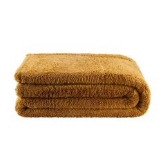 the brown towel is folded up on top of each other, and it's very soft