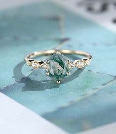 a green and white ring sitting on top of a table