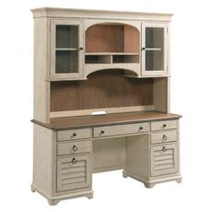 an old fashioned desk with hutch and drawers