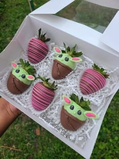 there are chocolate covered strawberries in the box