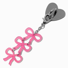 a heart shaped key chain with pink ribbon on it