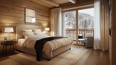 a bedroom with wood walls and flooring has a large window overlooking the snowy mountains