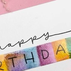 a birthday card with the word happy birthday written on it and colored crayons