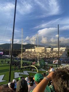 a stadium filled with lots of people watching a game