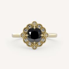 a black and white diamond ring with gold accents on the sides, surrounded by small diamonds