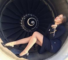 a woman is sitting in an airplane engine