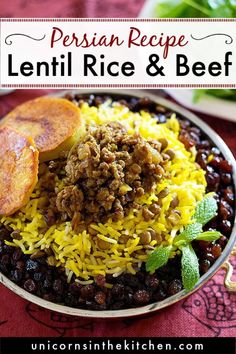 a bowl filled with rice and beans next to a plate full of greens on a table