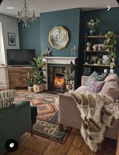 a living room filled with furniture and a fire place under a mirror on the wall