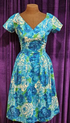 This pretty, silky dress is in excellent vintage condition.  Please be sure to note the flattering 5" long cap sleeves, the V of the decolletage and in the back, as well, the corresponding V at the waist in the front and pleats, front and back; note, too, the 2" wide waistband in the back that closes via snaps.  The attached tulle crinoline was sewn into the dress and bears a size 10 tag - which would make it equivalent to approximately a size 4-6 today. Approximate measurements: shoulder to shoulder:  12.5" armpit to armpit:  15" waist (flat):  12" hips (flat):  15" back length: 43" back metal zipper:  14" What a wonderful addition to your vintage clothing collection; it is a beautiful example of 1950s wearable textile art and fashion. We want you to love your purchase; if there is a prob Green And White Dress, 1960s Dresses, Silky Dress, 1950s Vintage, Metal Zipper, Wide Waistband, Dress Clothes For Women, Green And White, Textile Art