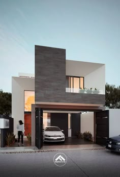 a car is parked in front of a modern house