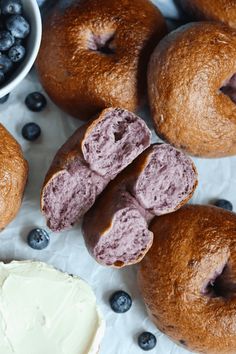 doughnuts with blueberries and cream cheese next to them