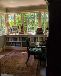 a living room filled with furniture and lots of books on top of a book shelf