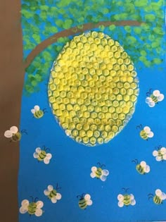 an art project with bees and a tree