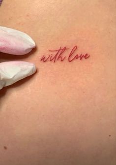 a woman's stomach with the word love written on it