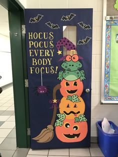 a door decorated with pumpkins and witches