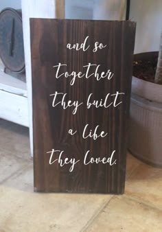 a wooden sign that says and so together they built a life they loved