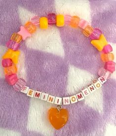 chappell roan Diy Kandi Bracelets, Diy Kandi, Orange Heart, Bracelet With Heart, Friendship Bracelets Designs, Kandi Patterns