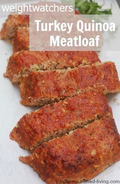 sliced meatloaf sitting on top of a white plate