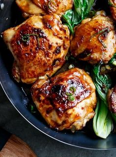 some meat and vegetables in a pan on a table