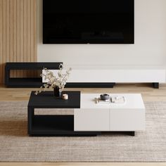 a white and black coffee table in front of a flat screen tv