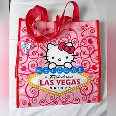 a hello kitty shopping bag with a welcome to fabulous las vegas sign on the front