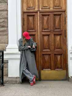 Red adidas, red hat, red cap, grey coat Casual Red Winter Hat, Grey Cap Outfit, Classic Red Winter Hat, Red Cap Outfit, Fitted Red Wool Hat, Warm Red Winter Hat, Playful Red Winter Hat, Gray Cap, Cap Outfit