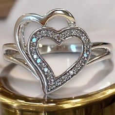 GORGEOUS Vintage Designer 14k White Gold DIAMOND Double Heart Ring Size 7.25 Gorgeous natural diamond ring!! * Beautifully crafted in solid 14k white gold with bright white natural diamonds on one heart! * Approximately thirty (30) - diamonds set into heart. * Size 7.25 * Weighs 3.5 Grams! Ships FAST AND FREE, gift boxed and fully insured mail! Double Heart Ring With Diamond Accents For Anniversary, Anniversary Double Heart Ring With Diamond Accents, Fine Jewelry Double Heart Diamond Ring With Accents, White Gold Rings With Diamond Accents For Valentine's Day, Double Heart Diamond Ring With Accents For Valentine's Day, Promise Double Heart Diamond Ring With Accents, Valentine's Day White Gold Ring With Diamond Accents, Valentine's Day White Gold Rings With Diamond Accents, Valentine's Day Double Heart Diamond Ring With Accents