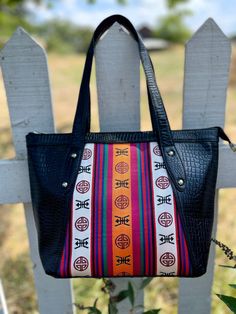 This bag was made by Tibetans in Northern India.  Brand Tenzing These bags are good quality and wrapped in real leather. Please consider supporting Himalayan handicraft artists through our shop! Traditional Bucket Bag With Removable Pouch, Traditional Bucket Bag With Leather Handles For Daily Use, Traditional Bucket Bag With Adjustable Strap For Everyday, Handmade Crossbody Shoulder Bag For On-the-go, Traditional Bucket Shoulder Bag For Everyday Use, Traditional Shoulder Bucket Bag For Everyday Use, Traditional Multicolor Bag With Removable Pouch, Multicolor Rectangular Shoulder Bag With Leather Handles, Traditional Multicolor Bags With Removable Pouch