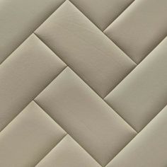 a close up view of a white leather textured wallpaper with diagonal lines and zigzag pattern