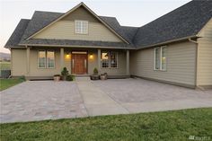 a house with a large driveway in front of it