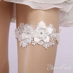 White lace wedding garters with flower applique and tiny beads. 1.Material:Lace 2.Embellishment: Lace Applique,Beads 3.Strechy:High 4.Picture Color:White 5.Quantity:1 piece/set 6.Circumference:40-60cm/15-23inch(Fits for thigh circumference of 40-60cm/15-23inch) White Lace Garter Bridal, Bride Leg Garter Lace, Rhinestone Garter, Bride Garter, Bridal Garter Lace, White Garters, Wedding Garter Lace, Unique Clothes For Women, Bridal Garter