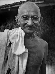 black and white photograph of an old man with glasses